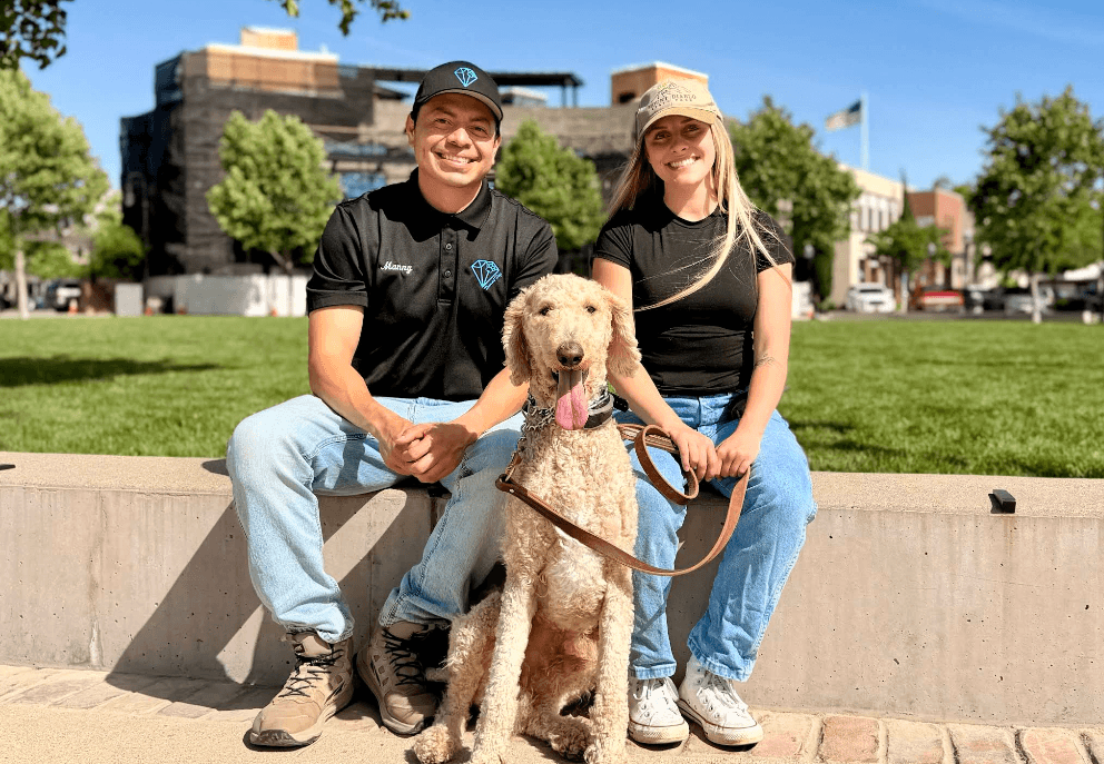 Manny and a happy dog with its owner