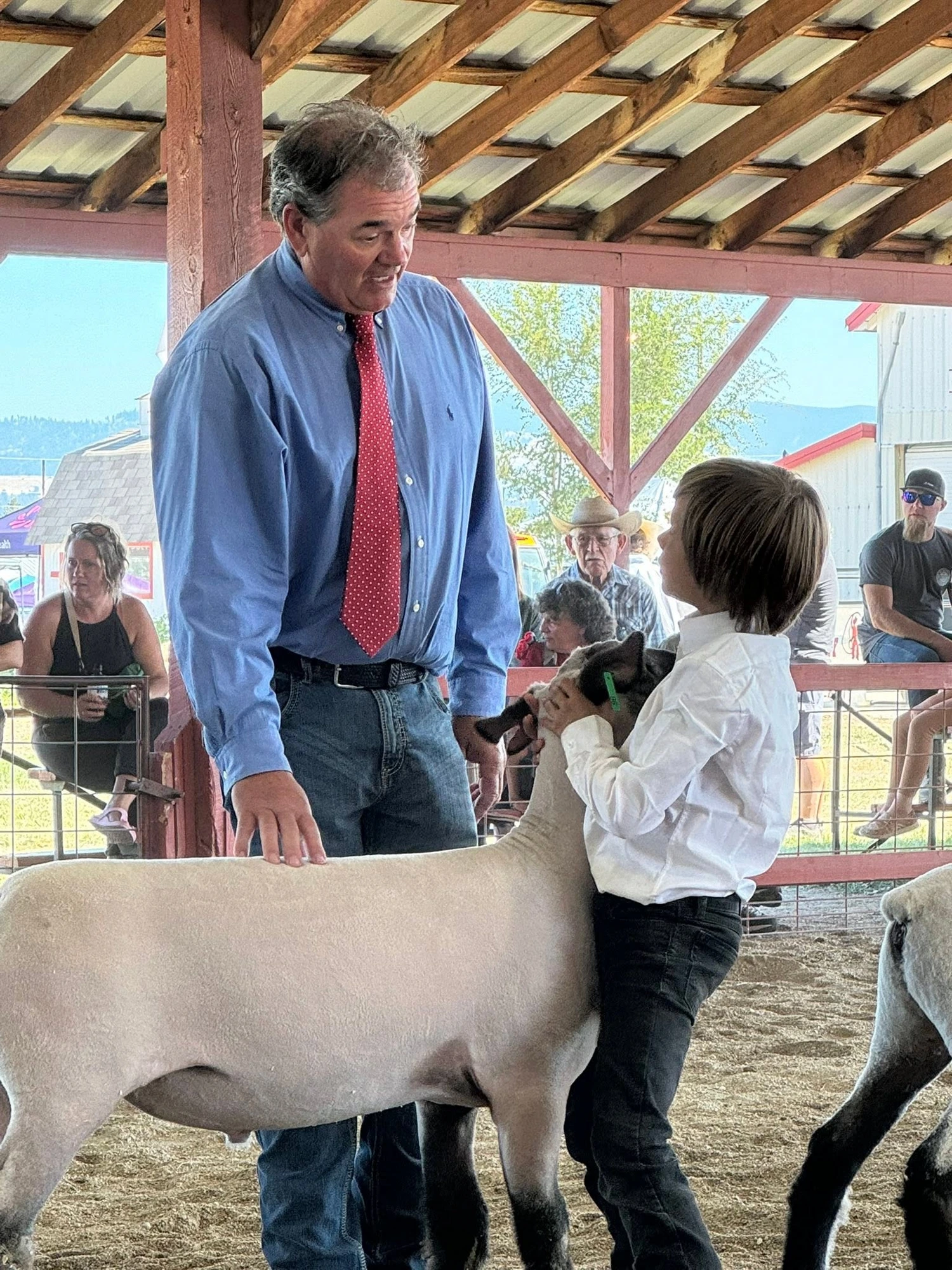 John Quinn mentoring a young exhibitor in the show ring