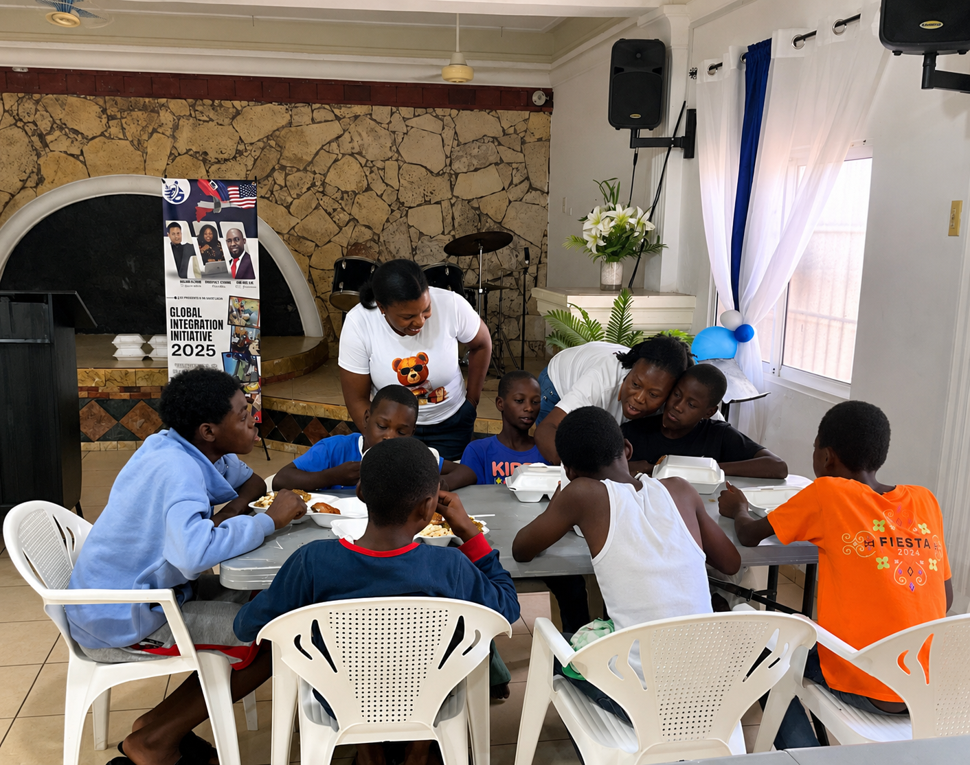 Volunteers serving a warm meal to children at a Street to Hope gathering
