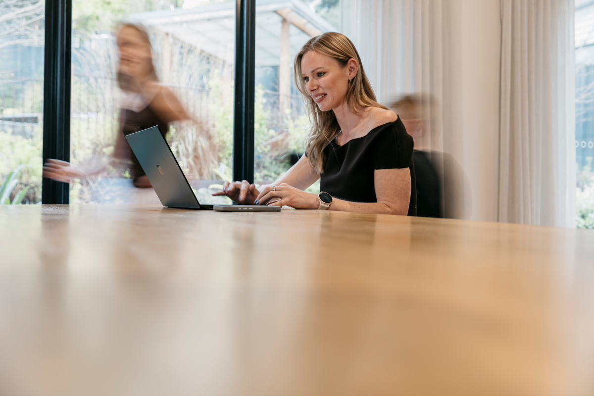 Caitlin Morrison working alongside the AtlasBroker team