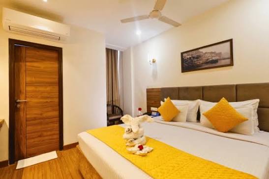Deluxe AC room with yellow curtains