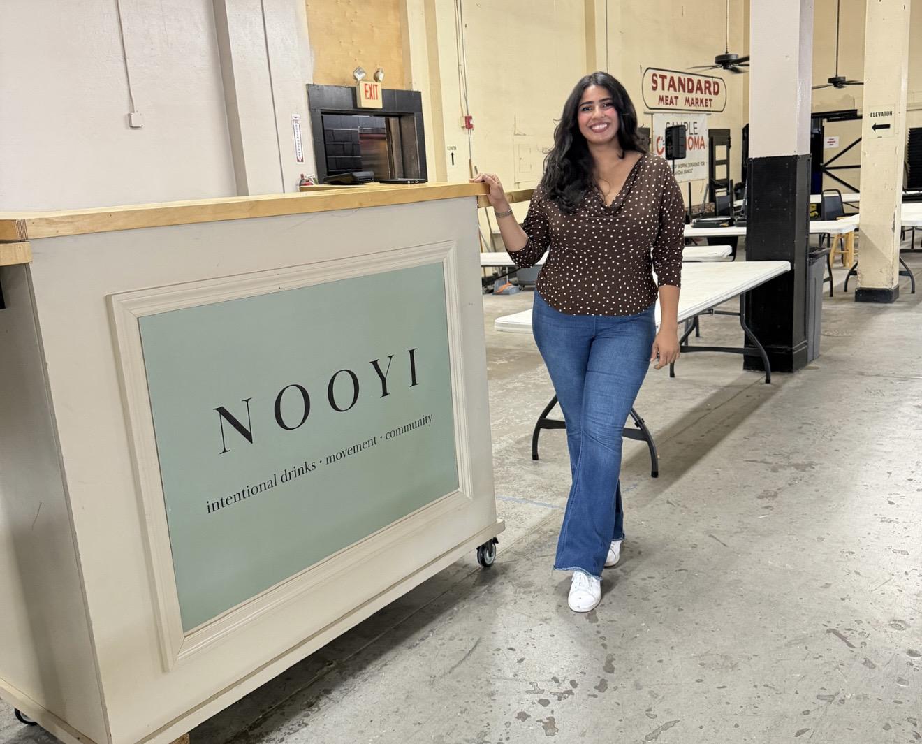Nooyi's founder beside the Nooyi coffee & matcha cart