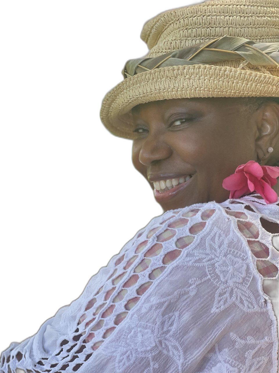 Clan Mother Shifa laughing joyfully in straw hat at the park, vitality radiating through her skin