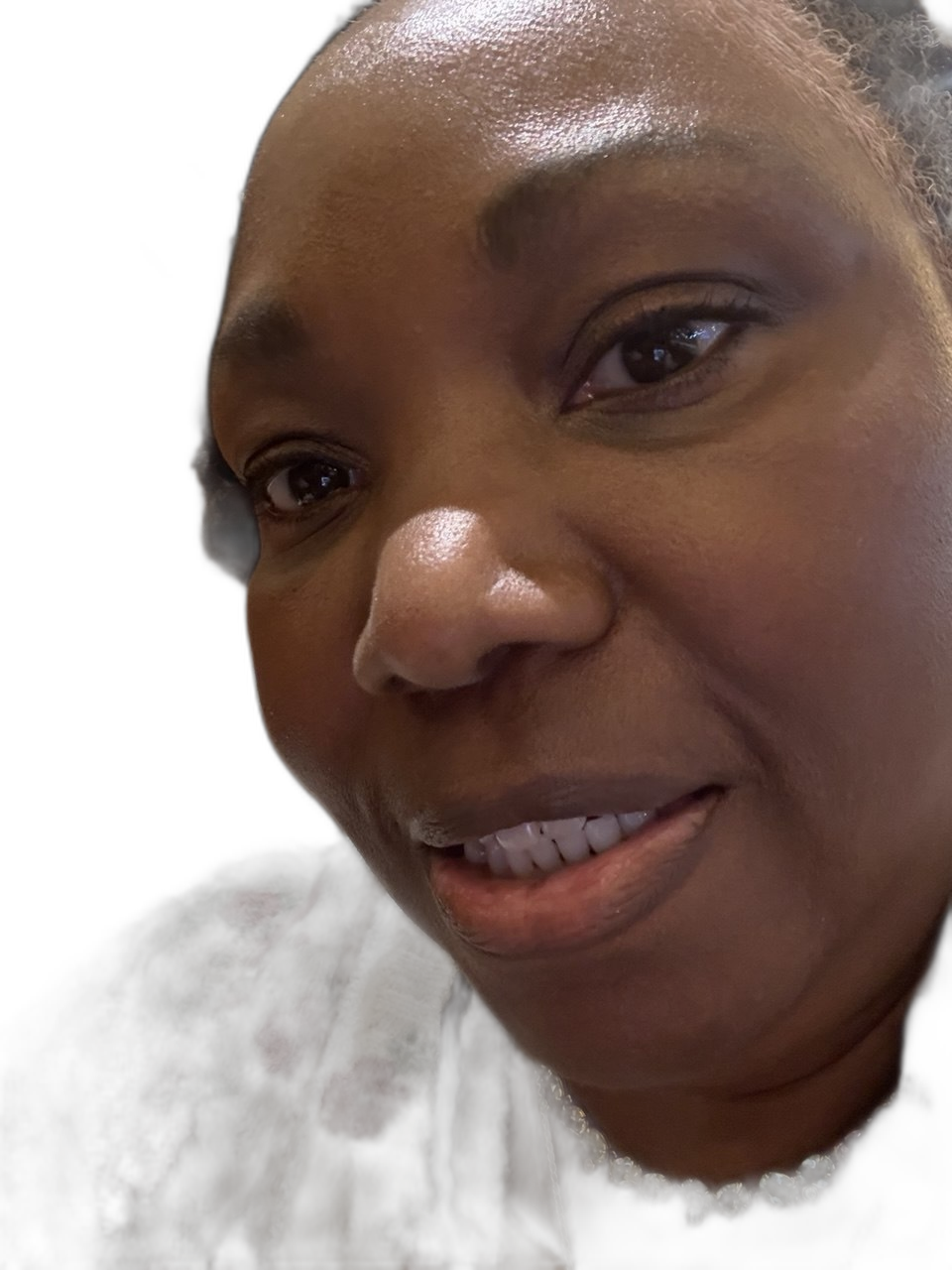 Intimate close-up of Clan Mother Shifa with crystal necklace, luminous complexion