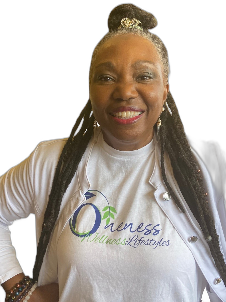 Clan Mother Shifa wearing the Oneness Wellness Lifestyles owl shirt, representing the lineage